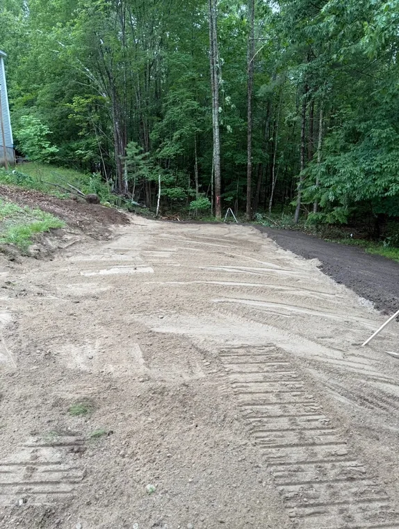 New gravel driveway graded from the road