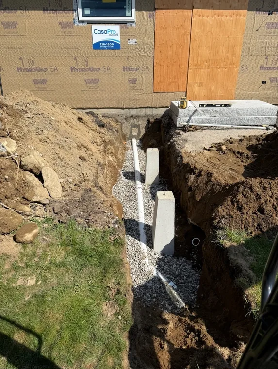 Sewer and water lines brought in through the foundation wall
