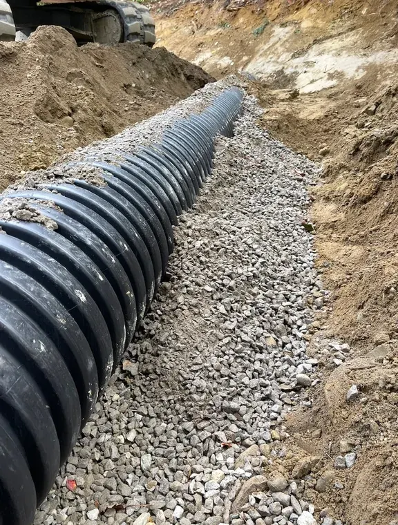 Culvert bedded in stone before backfill